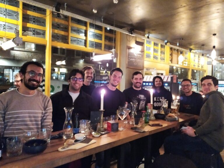 A group of spriteys having drinks and snacks in a bar